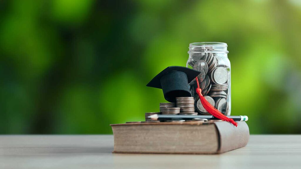 Guardian Scholars - Image of savings jar with a small graduation cap