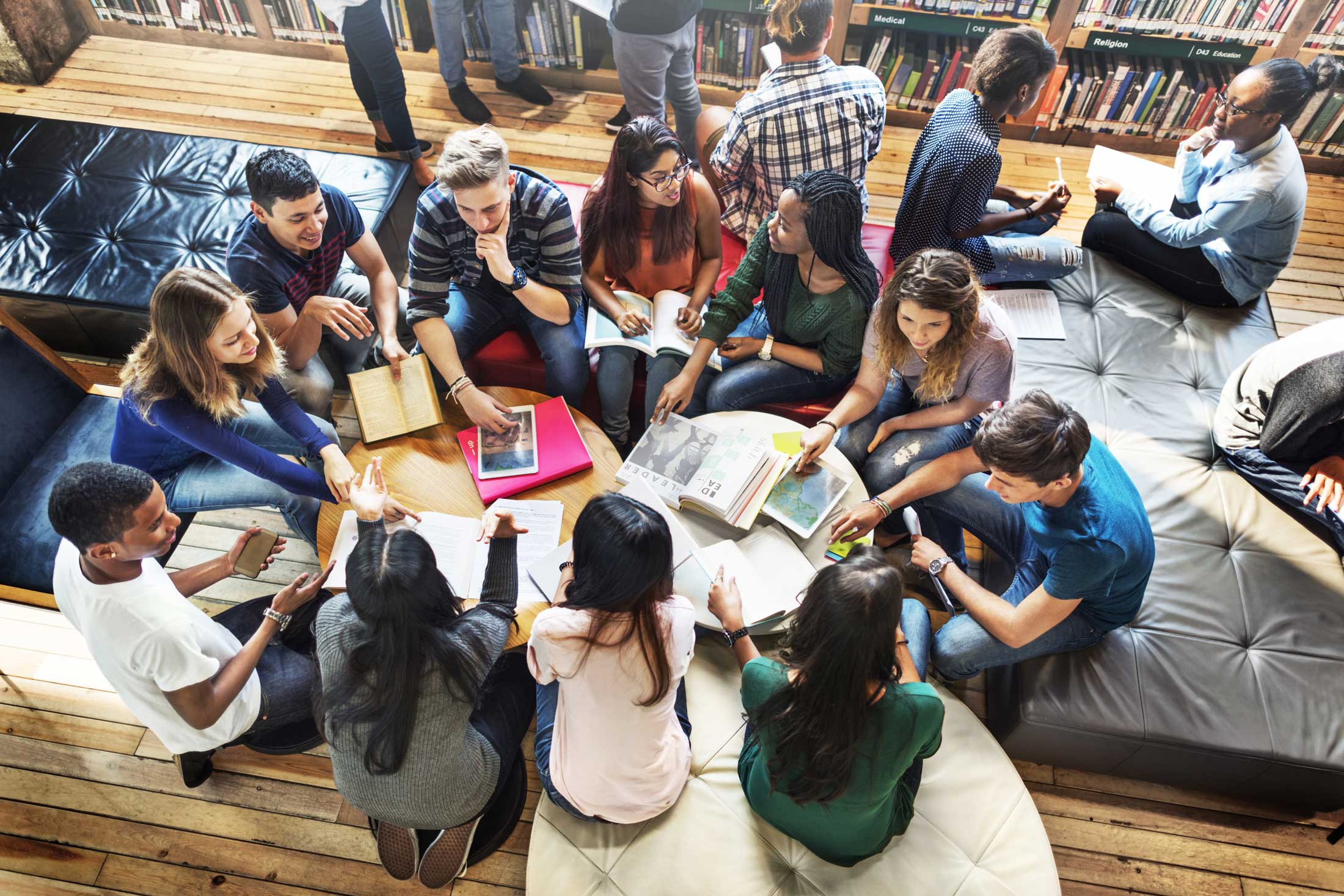 Image of college students in a group discussion from above